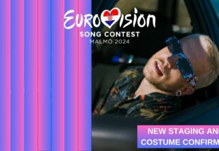 Baby Lasagna posing together with the eurovision logo and theme of this year.