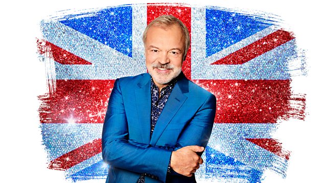 Commentator Graham Norton standing in front of a sparkly Union Flag